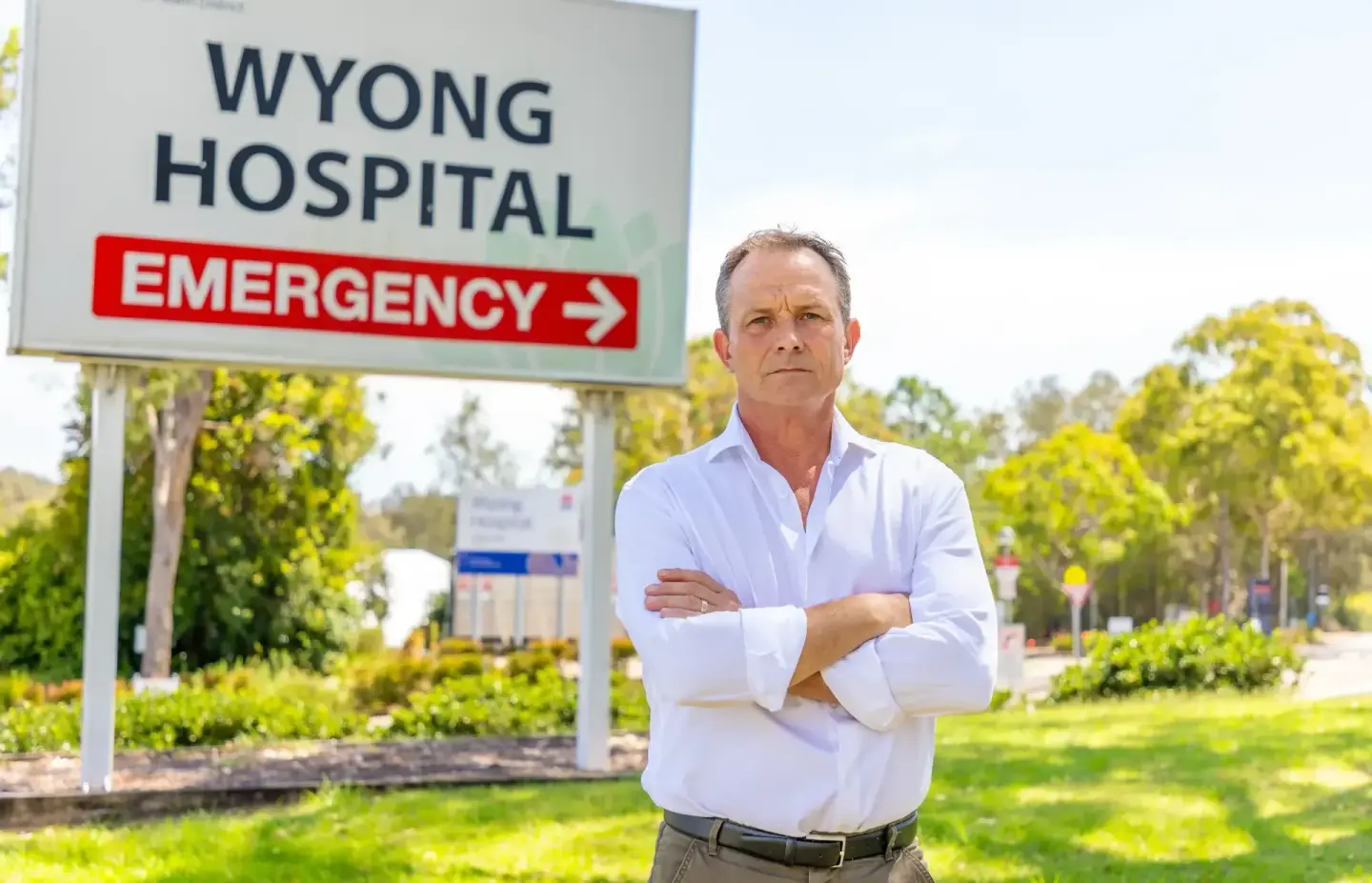Portrait of a local member outside Wyong Hospital's emergency entrance