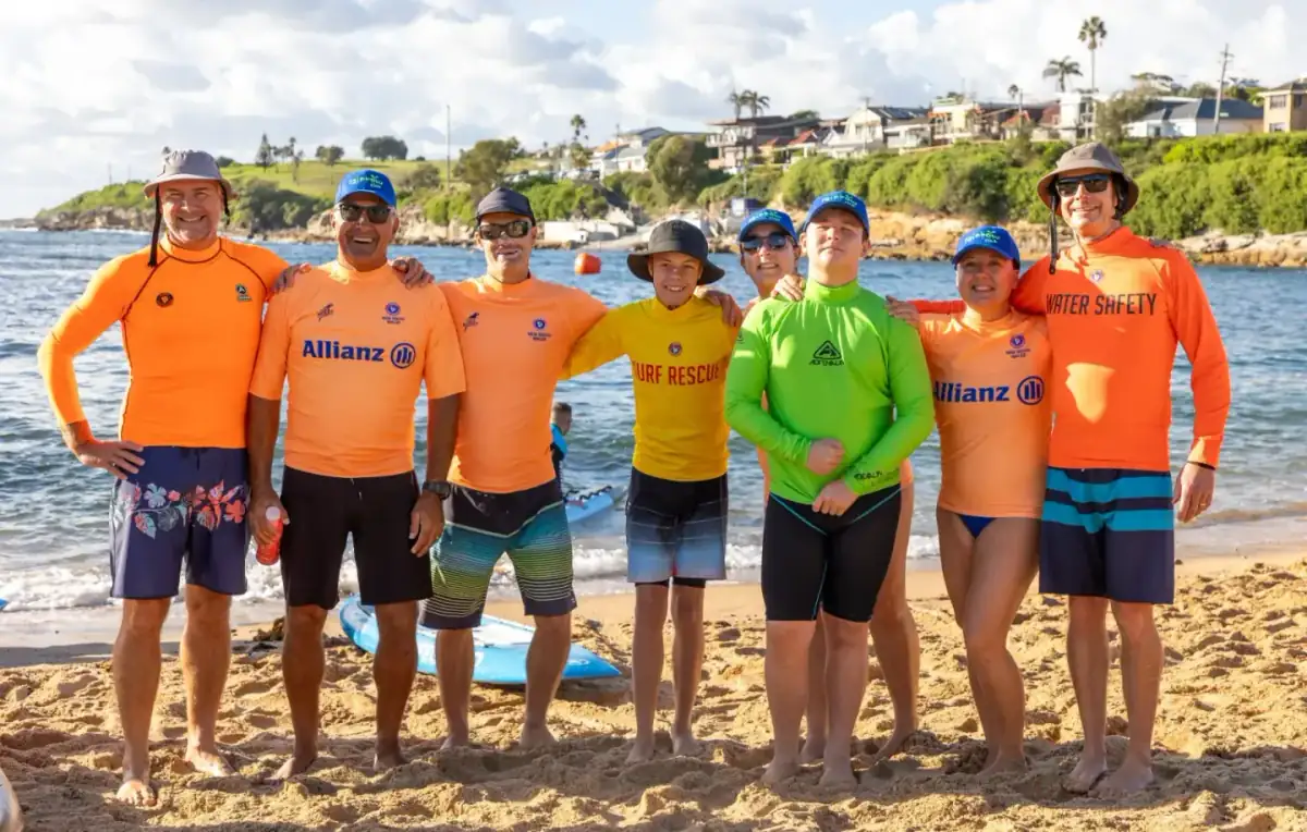 Water-safety crew lined up on the sand at Malabar Beach