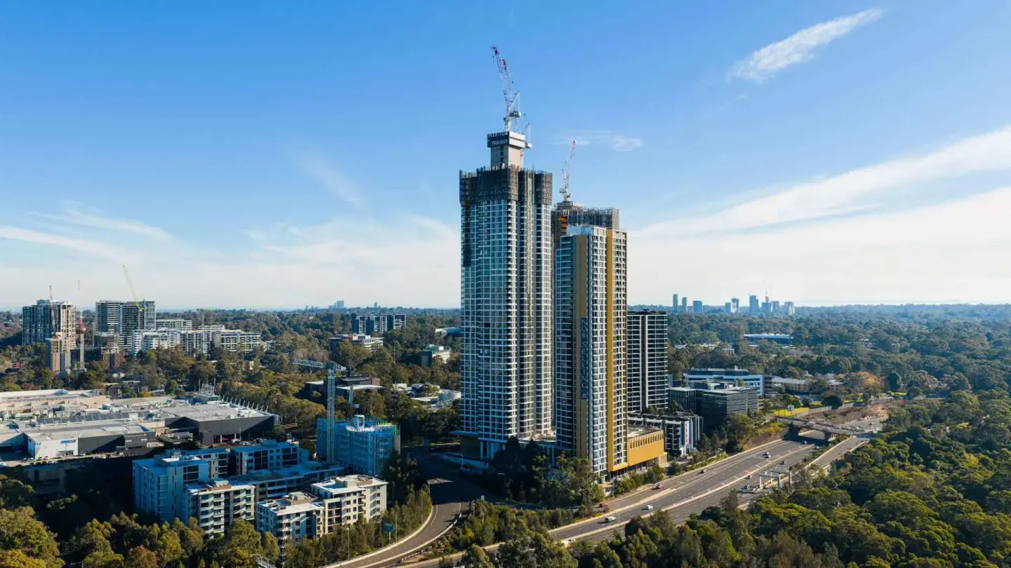 Aerial of new apartment towers beside the motorway corridor